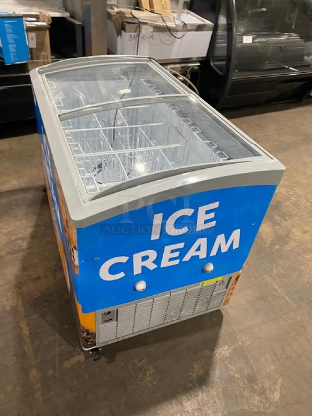 Excellence VB5HC ice cream merchandiser freezer, white with curved top, double sliding glass lid, poly coated wire baskets, 115V.
