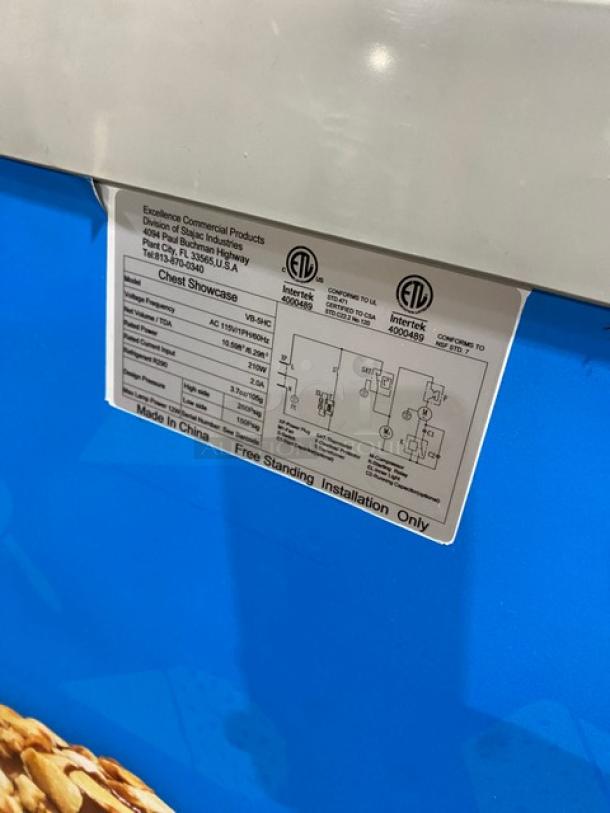 Excellence VB-5HC chest freezer with curved top, sliding glass lid, poly coated wire baskets, 115V, ETL certified label visible.