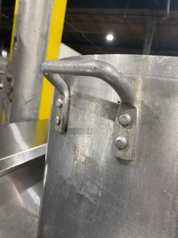 Winco Commercial Aluminum Stock Pot with wide base and sturdy handles. Durable condition, ideal for professional kitchens.