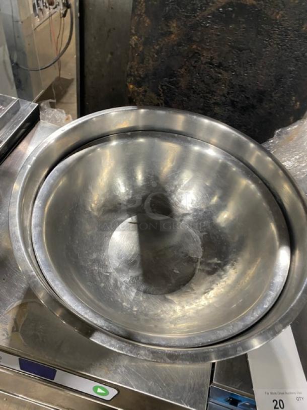 Commercial stainless steel mixing/prep bowl in good condition, featuring a smooth, reflective finish. Ideal for kitchen use.