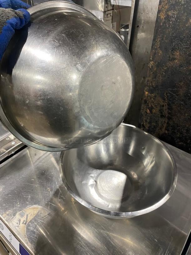 Stainless steel mixing/prep bowls, commercial grade, used condition, visible wear marks, sold as a lot.