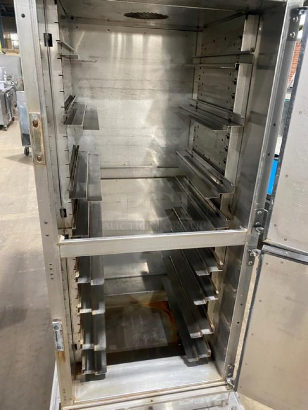 Winston Industries Cvap-4000A heated holding cabinet, model HA4522GE, stainless steel, half door, built-in pan slides, on casters.