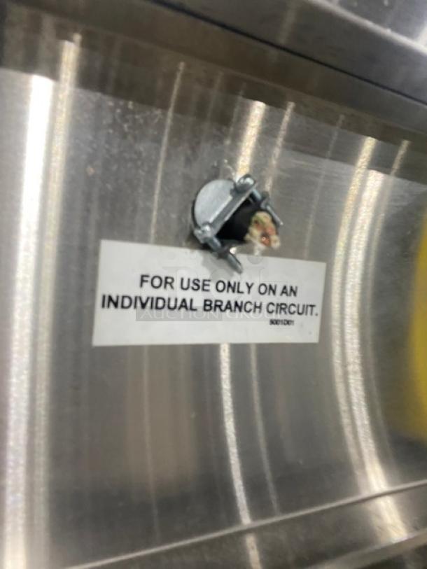 Stainless steel casing of Winston Industries Cvap-4000A heated holding cabinet. Label reads, "For use only on an individual branch circuit."