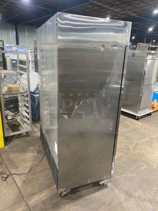 Atosa B-Series commercial stainless steel 2-door refrigerator, Model MBF8507, on casters, visible dents on the side.