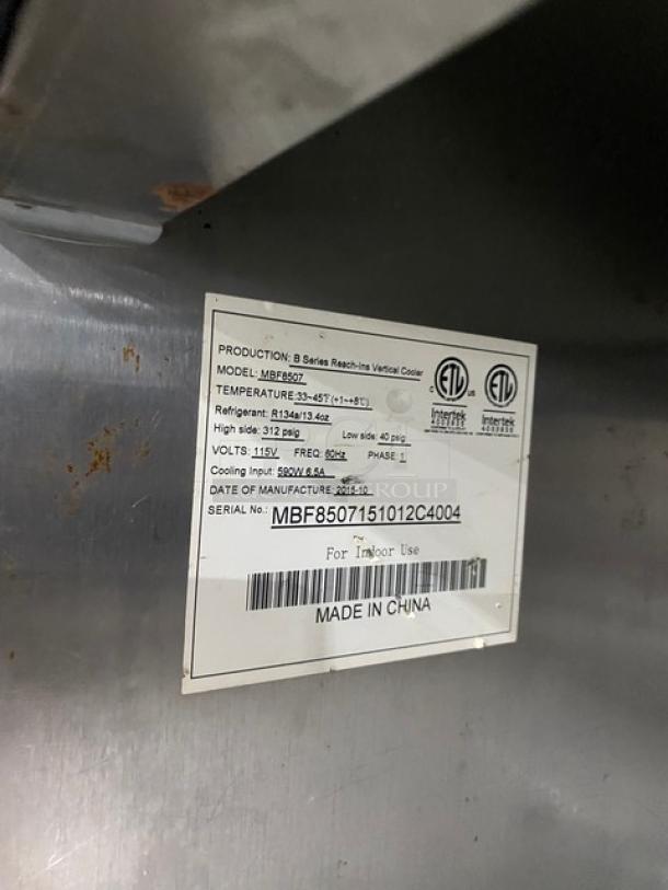 Atosa MBF8507 Commercial Stainless Steel 2-Door Refrigerator, tags show 115V, serial MBF8507151012C4004, on casters.