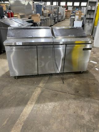 Continental 3-door refrigerated bain marie prep table, stainless steel, model SW72-18, on casters, with polly coated rack.