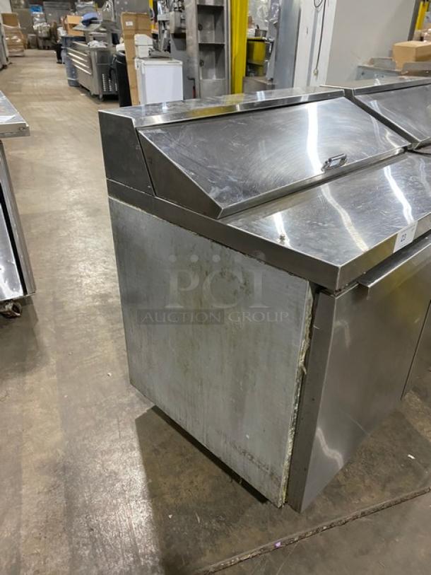 Continental 3-Door Stainless Steel Refrigerated Prep Table, Model SW72-18. Features polly coated wired rack, casters.