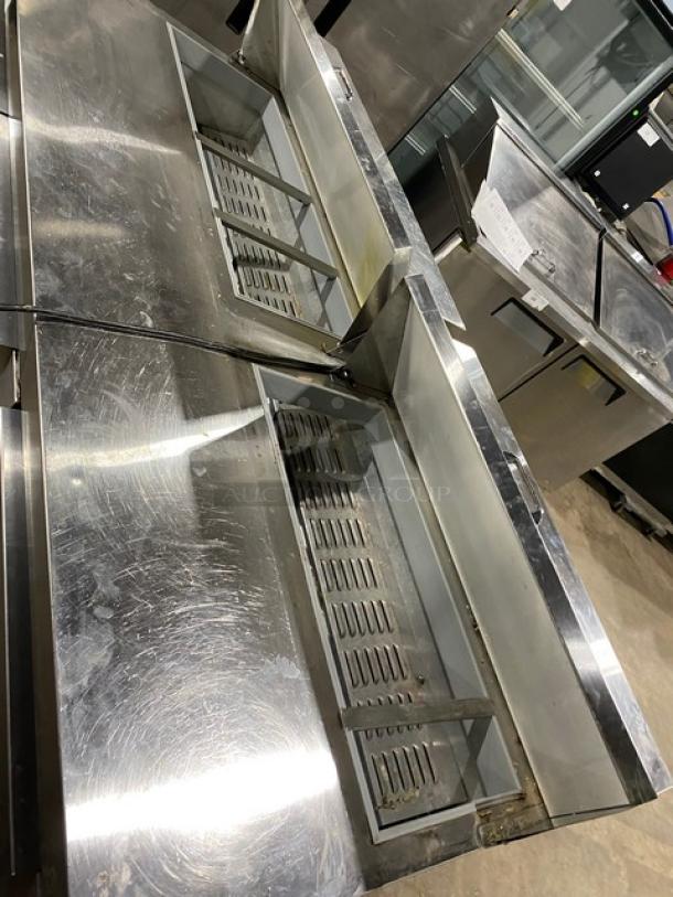 Continental stainless steel 3-door refrigerated prep table, model SW72-18, with poly-coated wire rack, on casters.