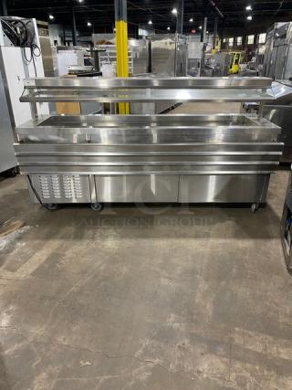 Servolift stainless steel refrigerated salad bar, model 502-6R-CW, with sneeze guard, foldable tray slide, and casters.
