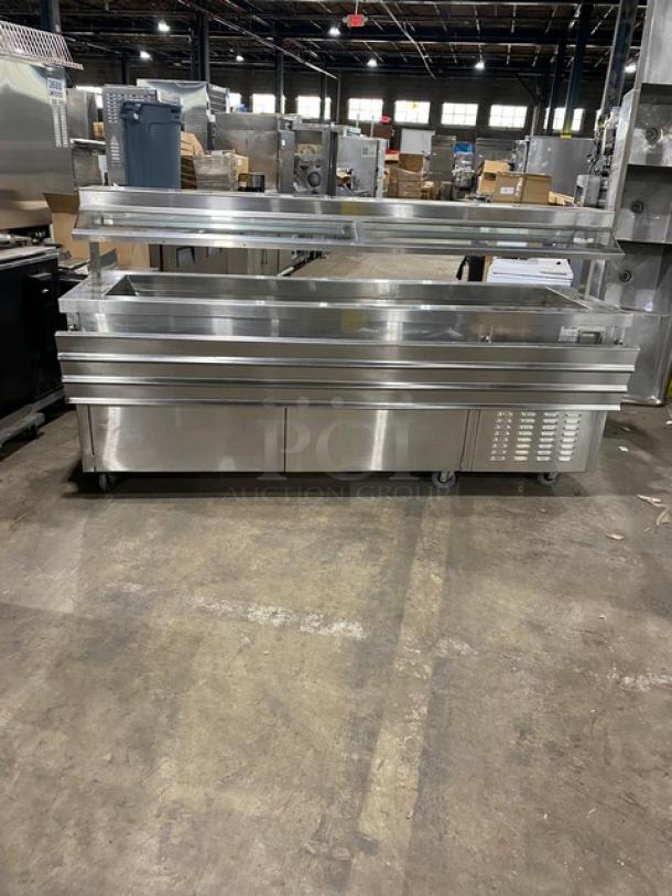 Servolift stainless steel refrigerated salad bar, model 502-6R-CW, with foldable tray slide, sneeze guard, and casters.