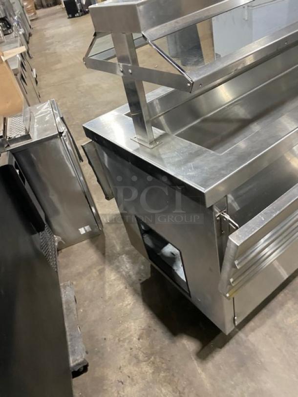 Servolift stainless steel refrigerated salad bar Model 502-6R-CW, with foldable tray slide, sneeze guard, and casters.