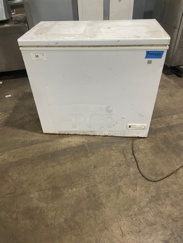 GE Appliances Commercial Chest Freezer, Model FCM7SUFWW, 115V, white exterior, visible wear, minor rust at base, SN: AA105789.