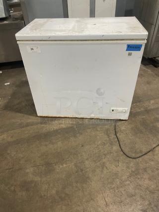 GE Appliances Commercial Chest Freezer, Model FCM7SUFWW, 115V, white exterior, visible wear, minor rust at base, SN: AA105789.