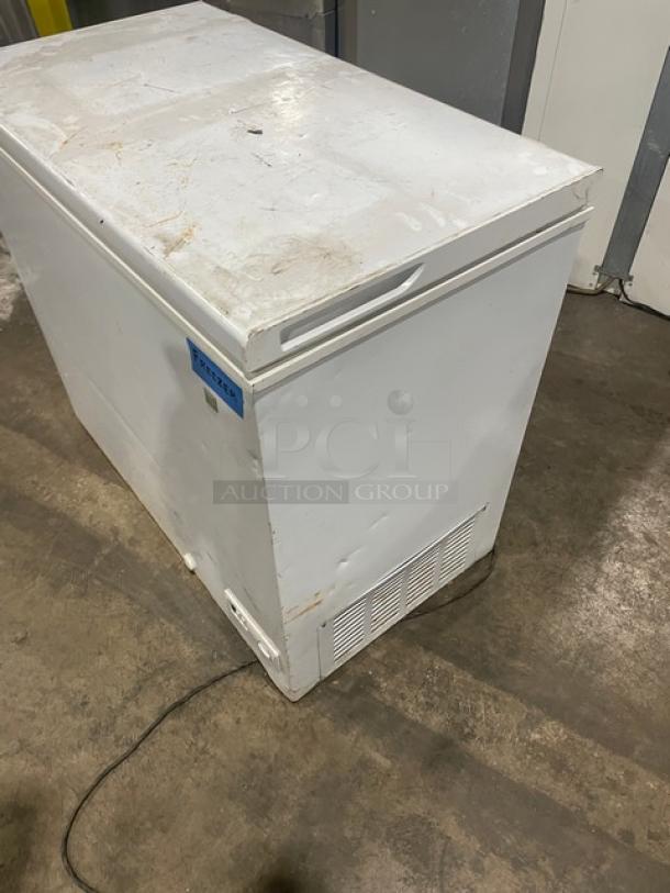 GE Appliances commercial white chest freezer, model FCM7SUFWW. Used condition, visible wear. 115V, SN: AA105789.