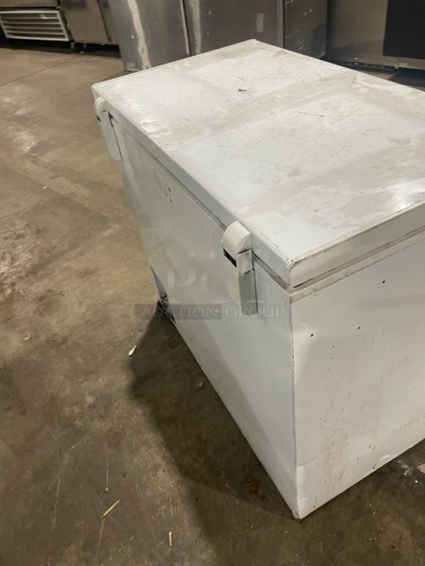 GE Appliances Commercial White Chest Freezer, Model FCM7SUFWW. Visible wear, 115V, sturdy build.