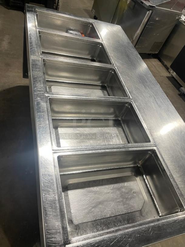 Delfield stainless steel 5-bay cold food bar, model 18MC68PEF, with 4 refrigerated drawers and enclosed undershelf.