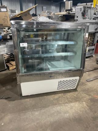 Custom Cool stainless steel deli merchandiser with slanted glass, multi-tier display, double sliding doors, and lower storage.