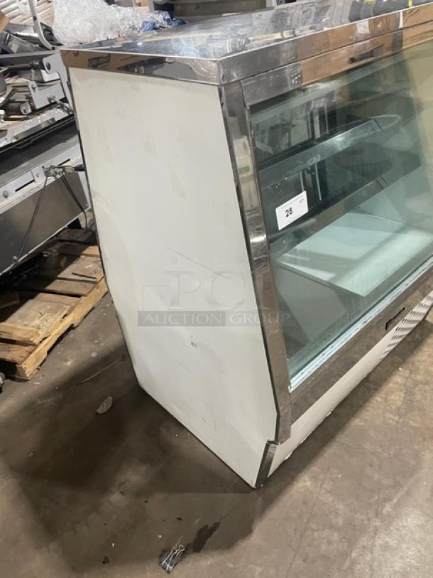 Custom Cool stainless steel deli merchandiser with slanted glass, multi-tier display, and double sliding glass doors. Includes lower storage.