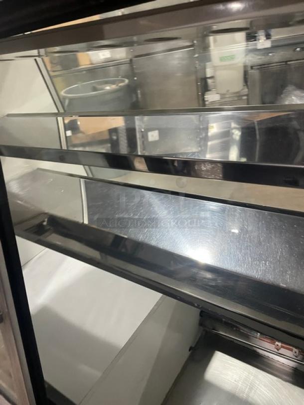 Custom Cool stainless steel refrigerated deli display with slanted glass, multi-tier shelving, double glass sliding doors, and lower storage.