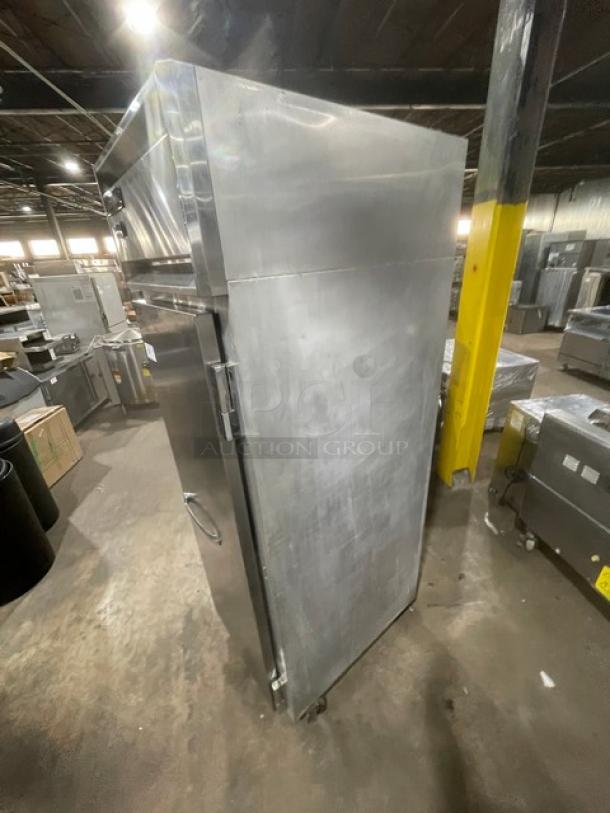 Continental stainless steel single door refrigerator, model 1RN, SN: 15967901, on casters, with built-in pan slides.