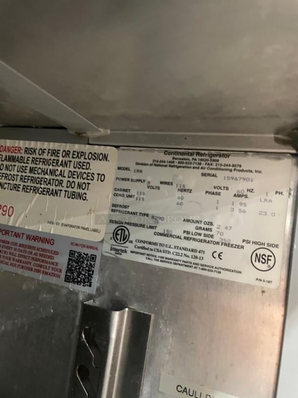 Continental single door stainless steel refrigerator, Model 1RN, SN: 15967901, 115V, 1 phase, with built-in pan slides and casters.