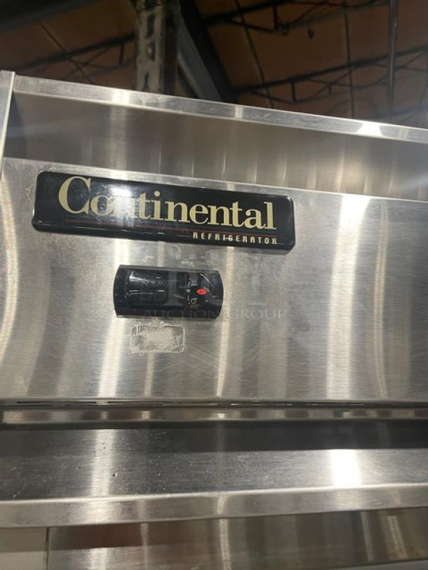 Continental commercial stainless steel refrigerator, model 1RN, single door, with built-in pan slides, on casters.