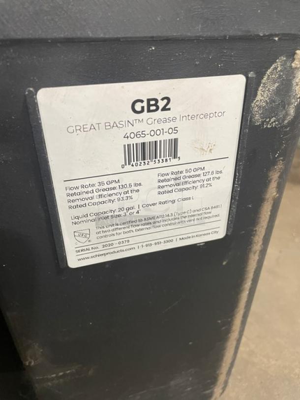 Schier Products Great Basin Series 20 Gal. Hydromechanical Grease Interceptor, Model 4065-001-05, Serial No. 2020-0379, black, worn label detailing flow rates and capacities.