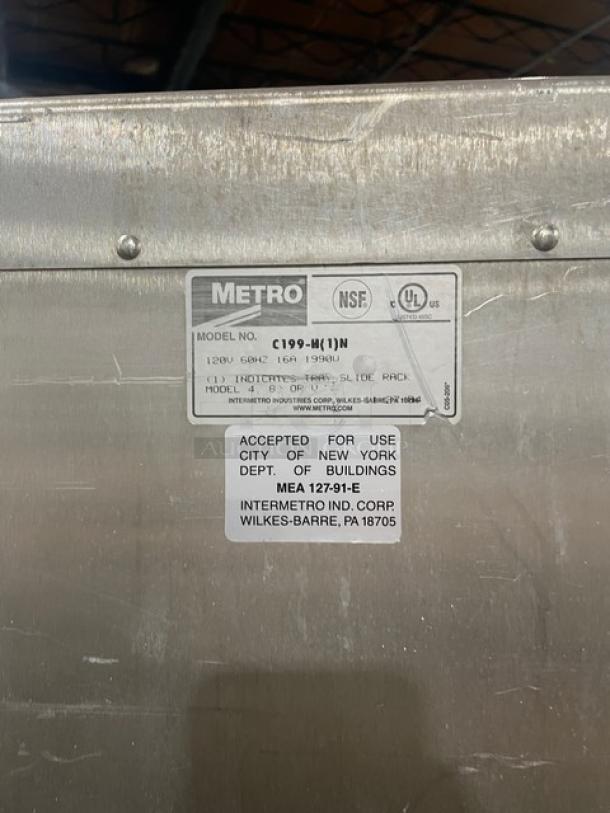 Metro C199H1N commercial heated cabinet tag, showing model, voltage, and certification details. Good condition, on casters.