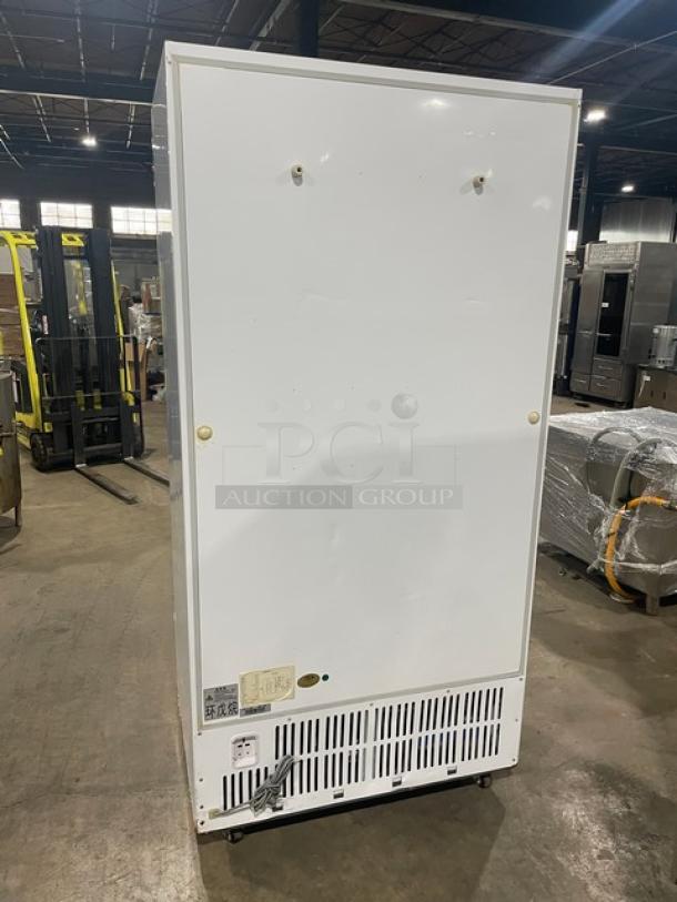 Commercial white double glass swing-door reach-in merchandiser refrigerator, model LG-800BF, on casters, 220V.