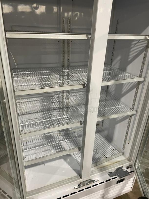 Commercial double glass swing-door refrigerator, model LG-800BF, with poly-coated wire racks, on casters.