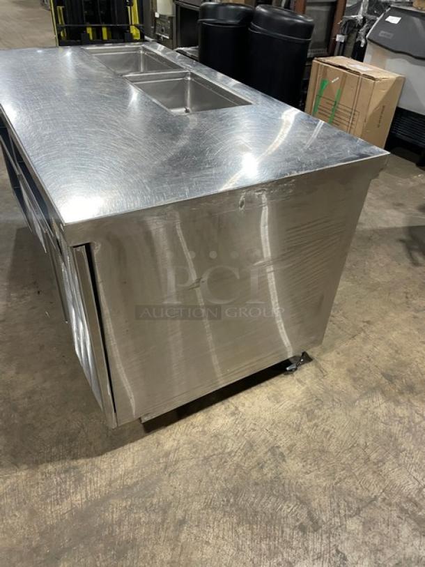 Delfield stainless steel refrigerated salad/sandwich prep table, model 18SC39P-EF, with triple storage, on casters.