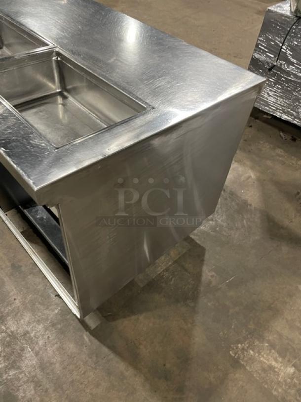 Delfield stainless steel refrigerated prep table, model 18SC39P-EF, with triple storage, on casters, in good condition.