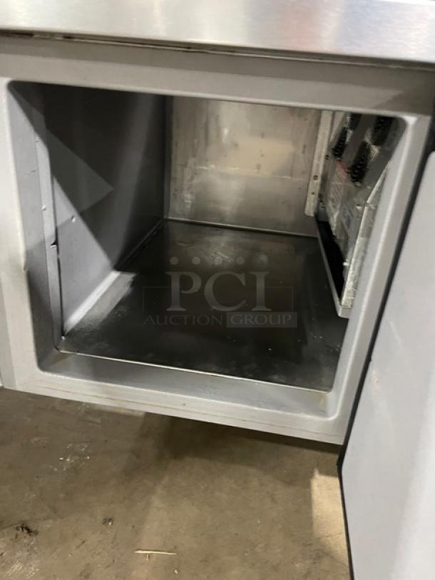 Delfield stainless steel salad/sandwich prep table, model 18SC39P-EF. Single door, triple storage, on casters, 115V, 1 phase.