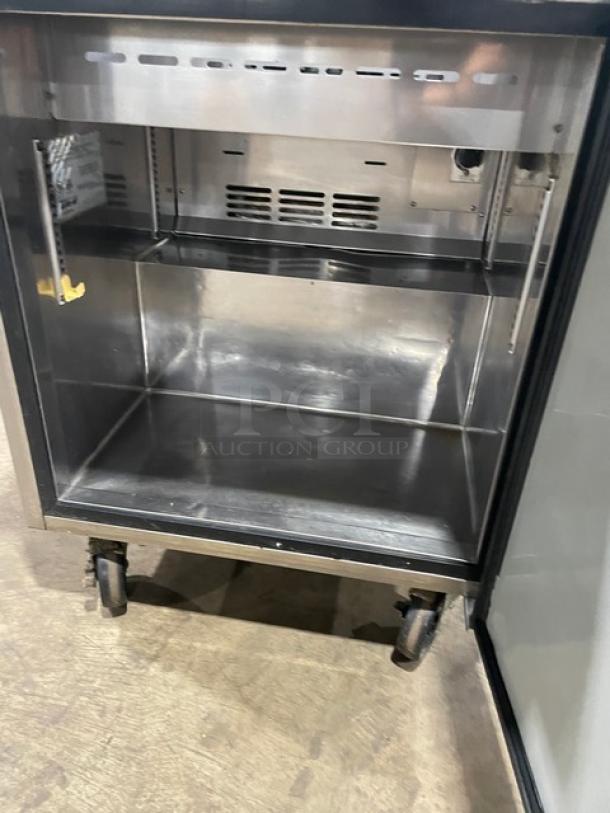 Turbo Air TST-28SD stainless steel refrigerated prep table with cutting board, 115V, single door, on casters, open view.