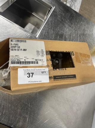 Brand new Cambro 32HP150 commercial amber 1/3-size 2" food pan in box, high-temperature resistant, with labels visible.