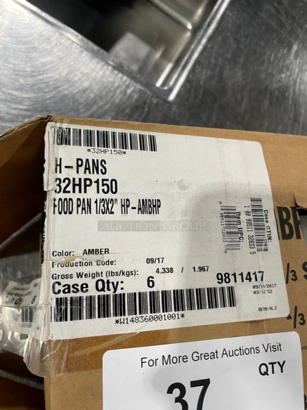 Brand new Cambro Amber High-Temperature 1/3-Size 2" Food Pan, Model 32HP150, shown in packaging with product labels.