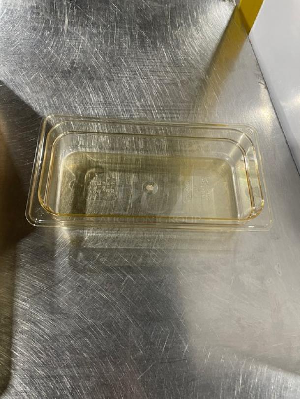 Brand new Cambro amber high-temp 1/3-size 2" food pan, model 32HP150, on a stainless steel surface.