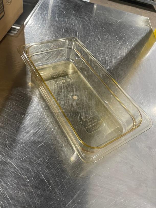 Brand new Cambro 32HP150 amber 1/3-size food pan, 2" high, high-temperature resistant, ideal for commercial use.