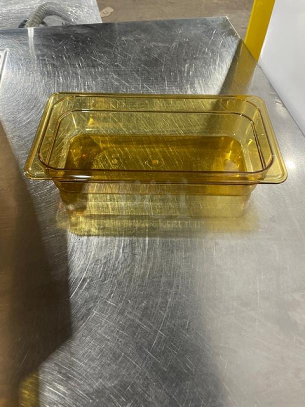 Brand new Cambro commercial amber high-temp 1/3-size food pan, 2.5" deep, model 32HP150. Durable, heat-resistant.
