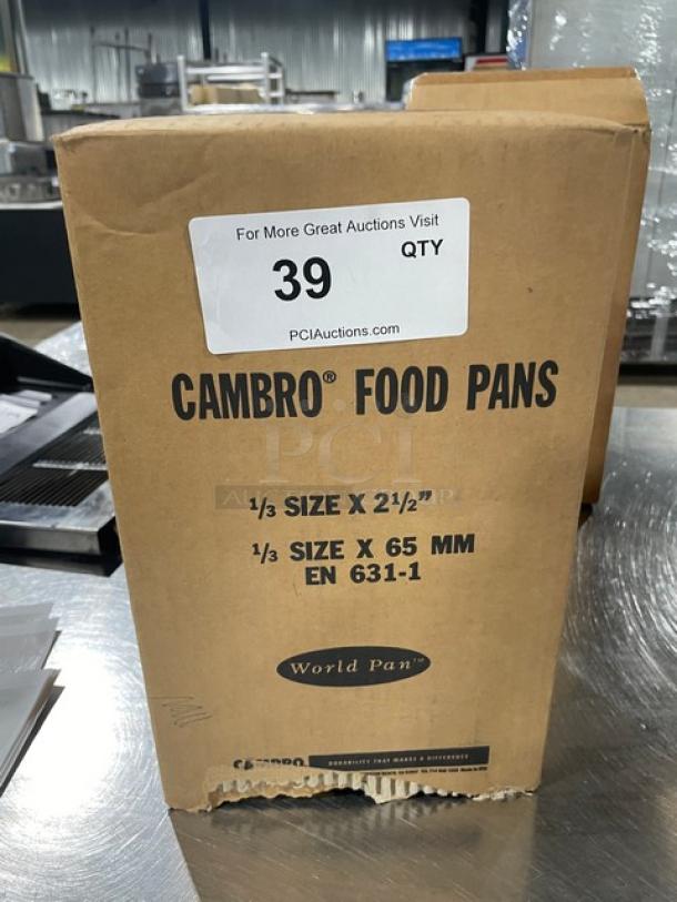 Brand new Cambro 32HP150 food pan box, 1/3-size, 2.5" deep, amber, high-temperature, model details and auction tag visible.