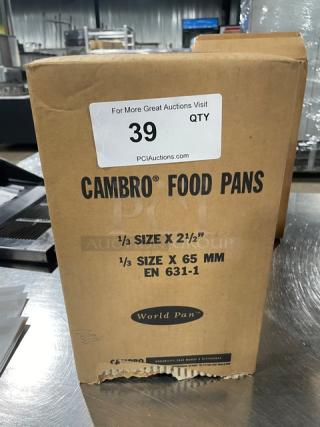 Brand new Cambro 32HP150 food pan box, 1/3-size, 2.5" deep, amber, high-temperature, model details and auction tag visible.