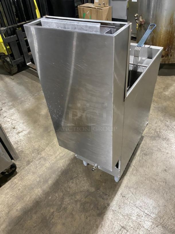 Pitco stainless steel 40 lb. natural gas fryer with backsplash, basket hanger, fry baskets, and legs. SN: G05BD006162.