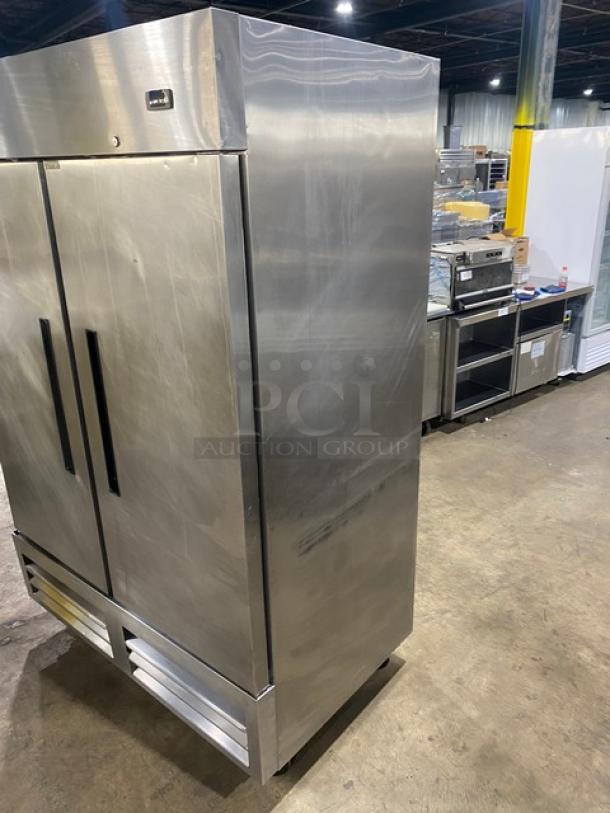 Arctic Air AR49EZ stainless steel 2-door reach-in refrigerator with poly-coated wire racks, on casters, 115V.
