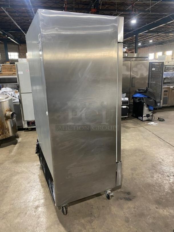 Arctic Air AR49EZ stainless steel 2-door refrigerator on casters, featuring poly-coated wire racks, 115V, model AR49EZ.