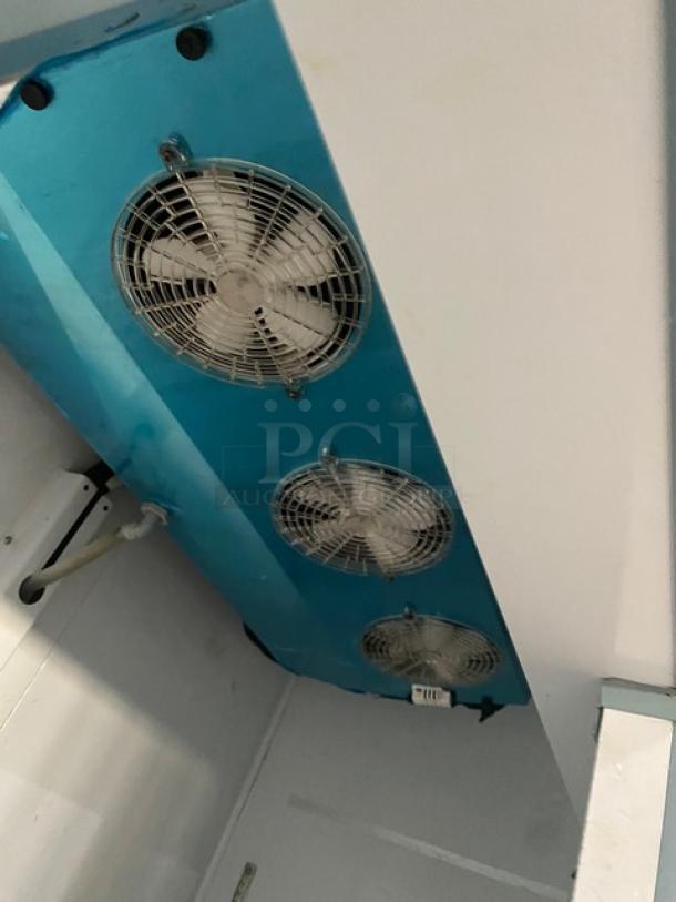 Arctic Air AR49EZ commercial fridge interior, showing cooling fans, model number, and clean condition.