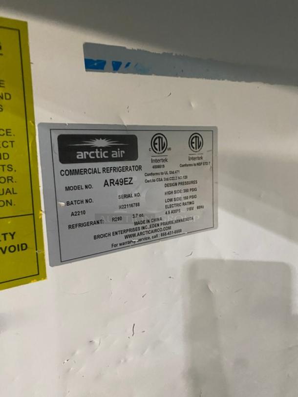 Arctic Air AR49EZ commercial refrigerator label showing model, serial number H22116788, and specs.