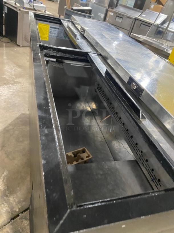Maxx Cold MXCR65B bottle cooler, black powder-coated, stainless steel top, double sliding lids, good condition. Model: MXCR65B.