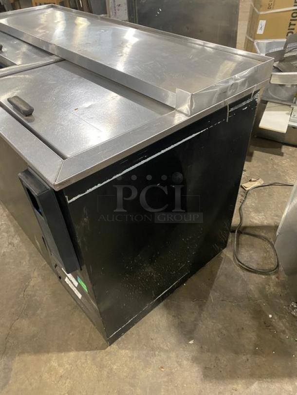 Fogel black powder-coated double section back bar bottle cooler, Model BC-50DBST, with stainless steel top and sliding lids, 115V.