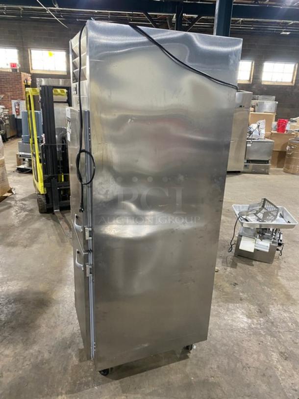 Traulsen stainless steel single-section refrigerator, model AHT132DUTHHS, on casters, with wired racks. 115V, 1 phase.