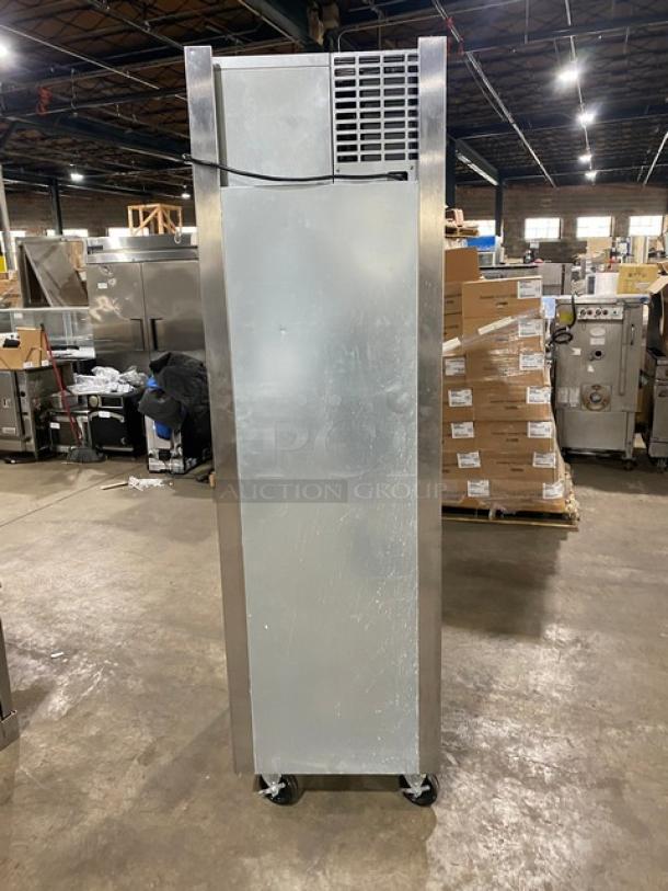 Traulsen AHT132DUTHHS single section stainless steel refrigerator, half door, on casters, with wired racks, 115V, 1 phase.